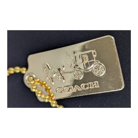 Coach metal bag tag 1.75"x7/8" stagecoach name on bottom.Ball chain included
EUC - Picture 1 of 7